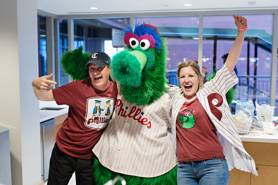 A bride and groom meet the Phillies Phanatic.
